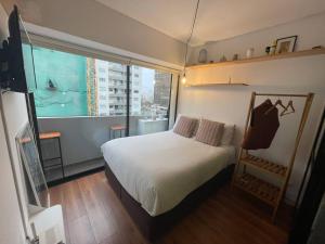 Ένα ή περισσότερα κρεβάτια σε δωμάτιο στο casahotel lof Arequipa