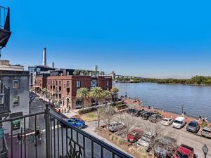 a view of a city with a river and buildings at Riverview Terrace in Savannah