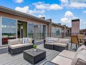 a patio with couches and a table on a deck at Riverview Estate in Savannah