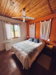 Una cama o camas en una habitación de Terrazas de Uspallata