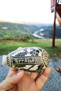 a person holding a toy animal in their hand at Rancho Alto Túcan in Buenos Aires +13 photos