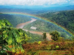 a rainbow in the middle of a river at Rancho Alto Túcan in Buenos Aires