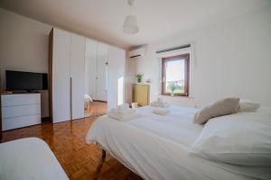 En eller flere senge i et værelse på Dimora del 700'