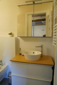 a bathroom with a sink and a mirror on a counter at La Gritta in Lerici +17 photos