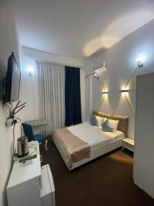 Ένα ή περισσότερα κρεβάτια σε δωμάτιο στο Best Center Nizami Hotel