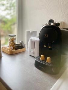 a coffee maker sitting on top of a counter at L'Escapade Charentaise Central et calme in La Rochefoucauld