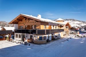 a large house in the snow with snow at Haus Daniela in Wildschönau