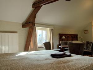 A bed or beds in a room at Havre de Paix - Séjour familial en pleine nature