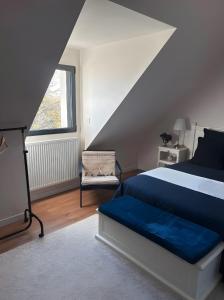 Voodi või voodid majutusasutuse Chambres D'hôtes Les Goélands toas