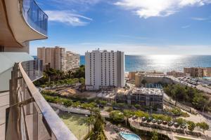 a view of the ocean from a balcony of a building at Sanset Waves with a sea view! in Benidorm
