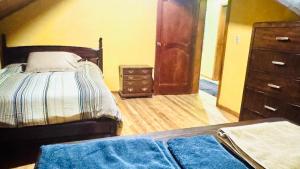 En eller flere senge i et værelse på Baños-Cuenca