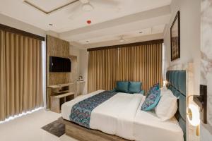 Ένα ή περισσότερα κρεβάτια σε δωμάτιο στο Hotel Sparsh Town