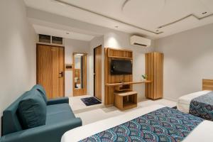 Μια τηλεόραση ή/και κέντρο ψυχαγωγίας στο Hotel Sparsh Town