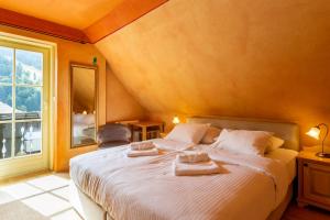 Postel nebo postele na pokoji v ubytování Pod Gora Boutique Hotel