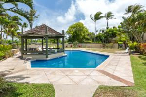 a gazebo next to a swimming pool at Tee and Sea Getaway ay Turtle Bay in Kahuku