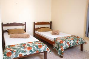 Ένα ή περισσότερα κρεβάτια σε δωμάτιο στο Hotel Coutinho PIO XII