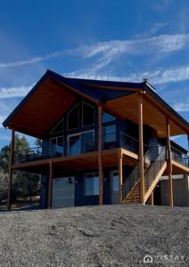 a house on top of a hill at The Wandering Doe Readers Retreat with Hot Tub in Long Valley Junction