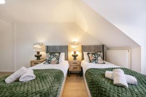 En eller flere senge i et værelse på Rooemah Lodge - Grampian Lettings + 19 billeder