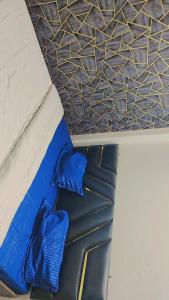 a blue tie sitting on top of a mattress at Shlok homestay in Varanasi +7 photos