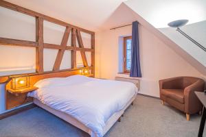 En eller flere senge i et værelse på Maison de Groupe - Salle de Jeux, Cuisine, salle à manger et Salon ouverts