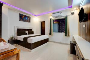 Voodi või voodid majutusasutuse Collection O Uttaranchal University Premnagar toas