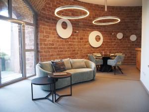 a living room with a couch and a table at Ein Traum im Turm, historischer Wasserturm Worms in Worms