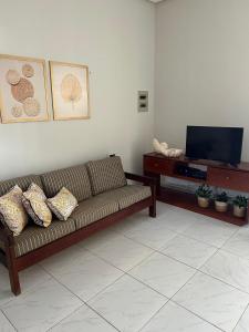 Et tv og/eller underholdning på Melhores Flats - Linda casa pertinho do mar