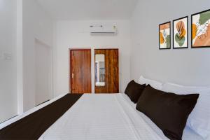 Voodi või voodid majutusasutuse Hotel O Muthalipalayam Bus Stand Coimbatore Formerly Haven Stays toas +25 fotot