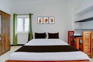 Voodi või voodid majutusasutuse Hotel O Muthalipalayam Bus Stand Coimbatore Formerly Haven Stays toas