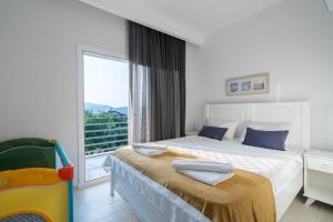 Postel nebo postele na pokoji v ubytování Villa Riva + 18 fotografií