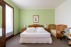 Ένα ή περισσότερα κρεβάτια σε δωμάτιο στο Casa Alba