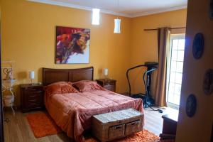 Postel nebo postele na pokoji v ubytování D'Ouro Meu House