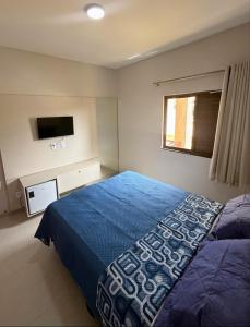 En eller flere senge i et værelse på Sunshine Chalet - Cozy Stay in Santo Amaro - Dunas Village Residence + 31 billeder