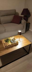 a coffee table in a living room with a couch at La Ville Haute in Chauvigny