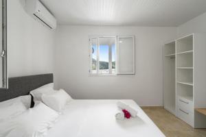 Ένα ή περισσότερα κρεβάτια σε δωμάτιο στο Villa Blanc de blanc +21 φωτογραφίες