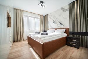 Ένα ή περισσότερα κρεβάτια σε δωμάτιο στο Best Central LUX Studio