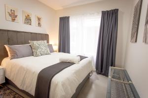 En eller flere senge i et værelse på Luxury York Retreat - Apartment 34