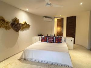 Ένα ή περισσότερα κρεβάτια σε δωμάτιο στο Luxury Oceanfront Escape