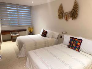 Ένα ή περισσότερα κρεβάτια σε δωμάτιο στο Luxury Oceanfront Escape