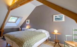 Giường trong phòng chung tại Un toit sous les étoiles