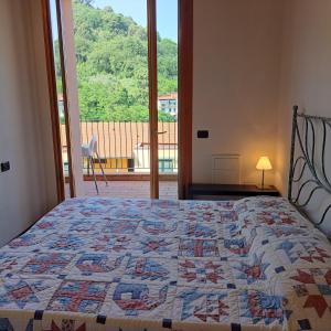 Ένα ή περισσότερα κρεβάτια σε δωμάτιο στο Lerici – Foyer Verde Mare