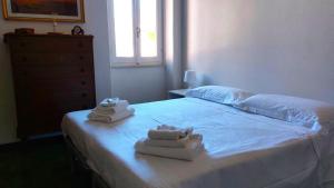 Ένα ή περισσότερα κρεβάτια σε δωμάτιο στο Lerici - Il Terrazzino Di Zia