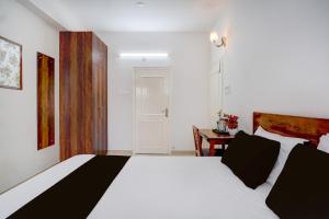 Ένα ή περισσότερα κρεβάτια σε δωμάτιο στο Hotel O La Vita Oasis