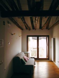 a living room with a couch in front of a window at Casa Alejandra in Murchante