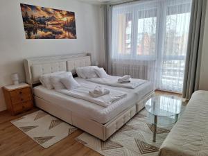 Ένα ή περισσότερα κρεβάτια σε δωμάτιο στο Vila Gabriel