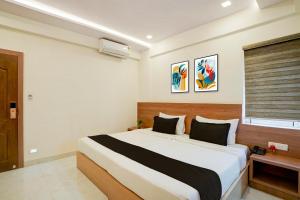 Ένα ή περισσότερα κρεβάτια σε δωμάτιο στο Hotel O Mirage Suites