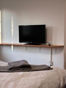 Μια τηλεόραση ή/και κέντρο ψυχαγωγίας στο WohnService Apartment