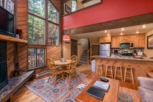 a kitchen and living room with a table and chairs at Ski Access SS7B Retreat Pet Friendly in Brian Head