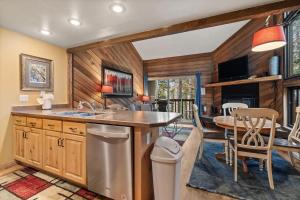 a kitchen with a sink and a table in a room at Ski Access SS7B Retreat Pet Friendly in Brian Head +40 photos