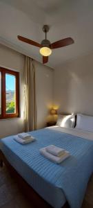 Ένα ή περισσότερα κρεβάτια σε δωμάτιο στο Doma Apartments 